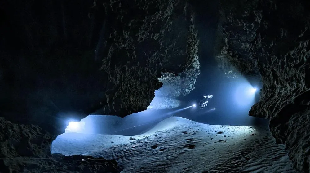 Divers exploring an underwater cave